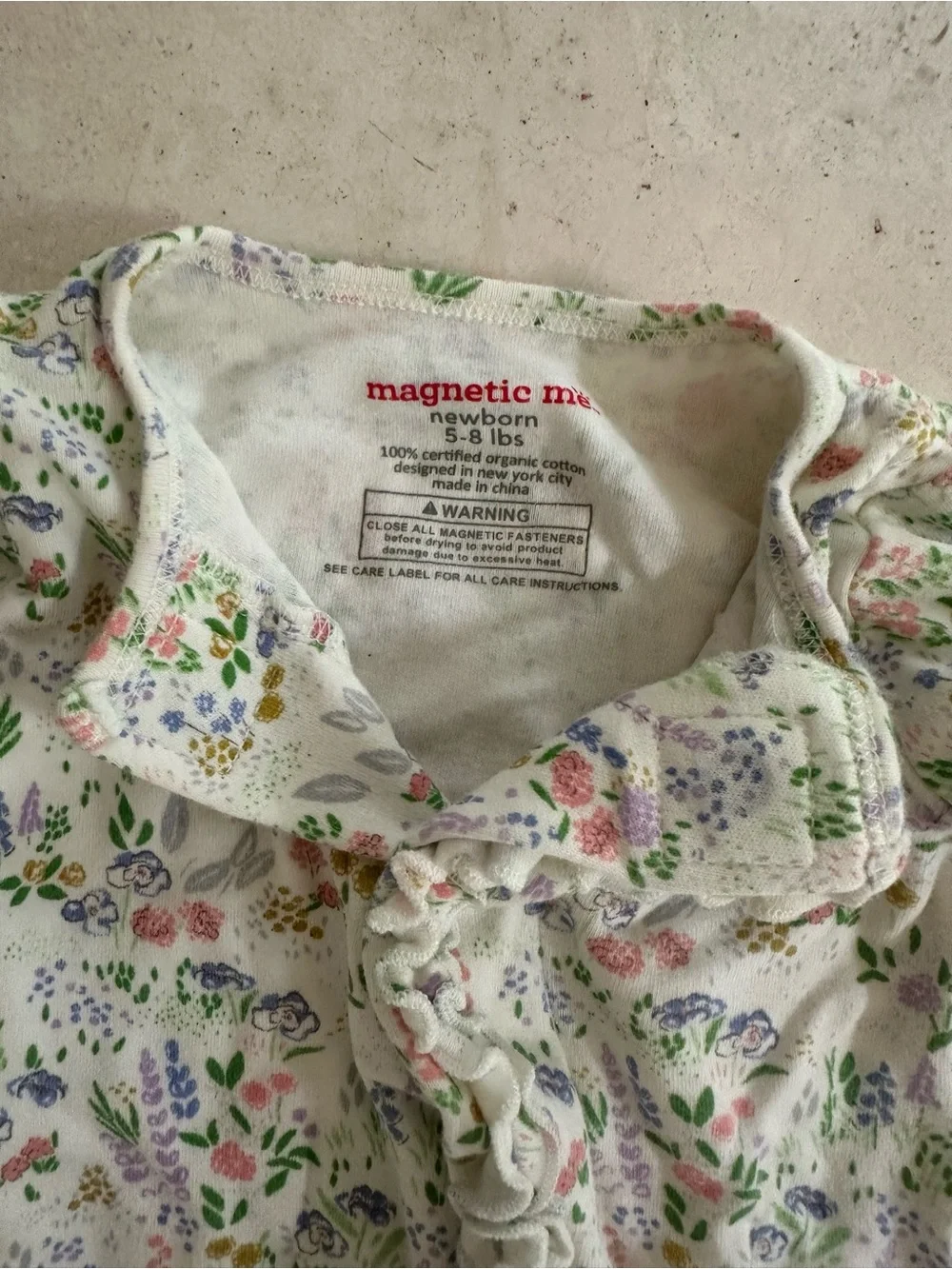 Magnetic Me White Footed One-Piece with Pastel Floral Print